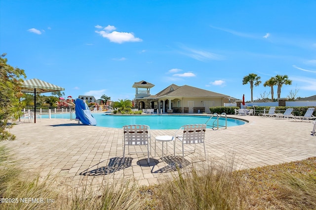 95297 Windflower Trl, Fernandina Beach, FL 32034 - community pool with a patio area