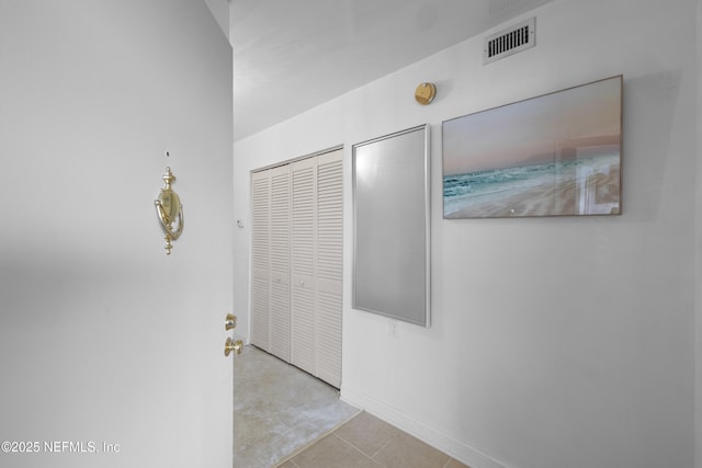 1071 Edgewood Ave S Unit 407, Jacksonville, FL 32205 - hall featuring baseboards and tile patterned flooring