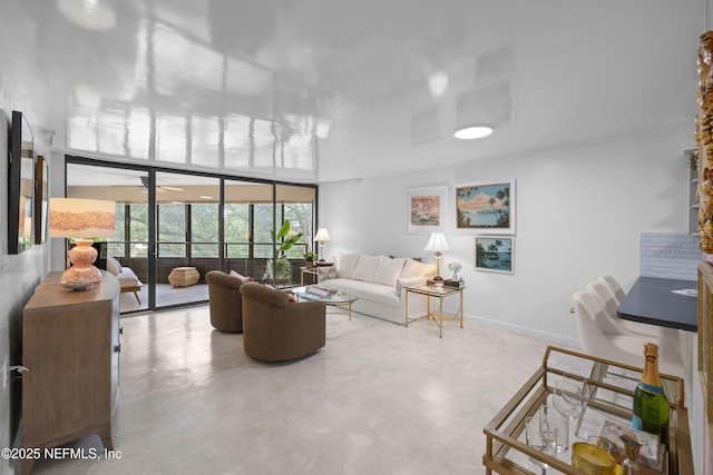 1071 Edgewood Ave S Unit 407, Jacksonville, FL 32205 - living area with finished concrete flooring and baseboards
