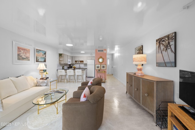 1071 Edgewood Ave S Unit 407, Jacksonville, FL 32205 - living room featuring finished concrete flooring and recessed lighting