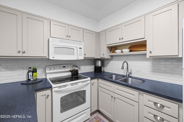 1071 Edgewood Ave S Unit 407, Jacksonville, FL 32205 - kitchen featuring white appliances, backsplash, dark countertops, and open shelves