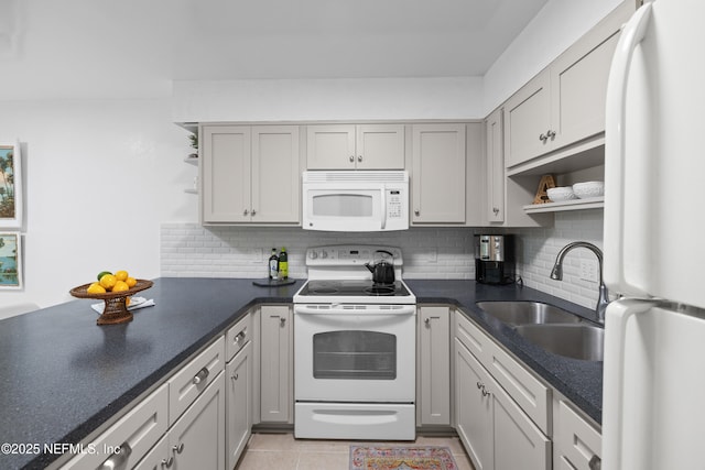 1071 Edgewood Ave S Unit 407, Jacksonville, FL 32205 - kitchen with white appliances, open shelves, dark countertops, and backsplash