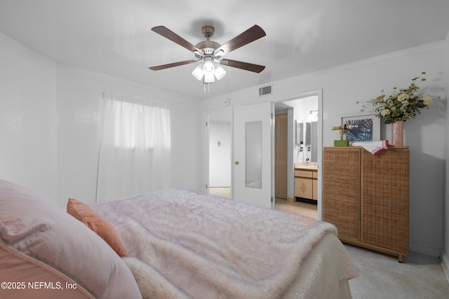 1071 Edgewood Ave S Unit 407, Jacksonville, FL 32205 - bedroom featuring ensuite bath, light colored carpet, and ceiling fan