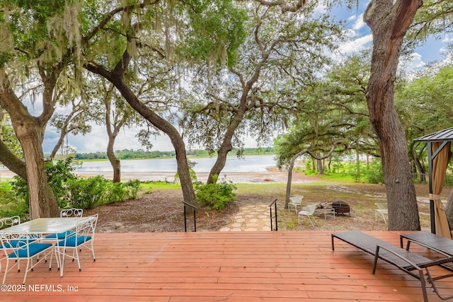 5299 County Road 352nd Rd, Keystone Heights, FL 32656 - wooden terrace with a water view, a fire pit, and outdoor dining area