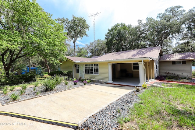 5299 County Road 352nd Rd, Keystone Heights, FL 32656 - view of front of home with concrete driveway, an attached carport, and a metal roof