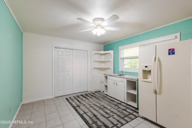 5299 County Road 352nd Rd, Keystone Heights, FL 32656 - kitchen featuring white refrigerator with ice dispenser, open shelves, ceiling fan, crown molding, and light tile patterned floors