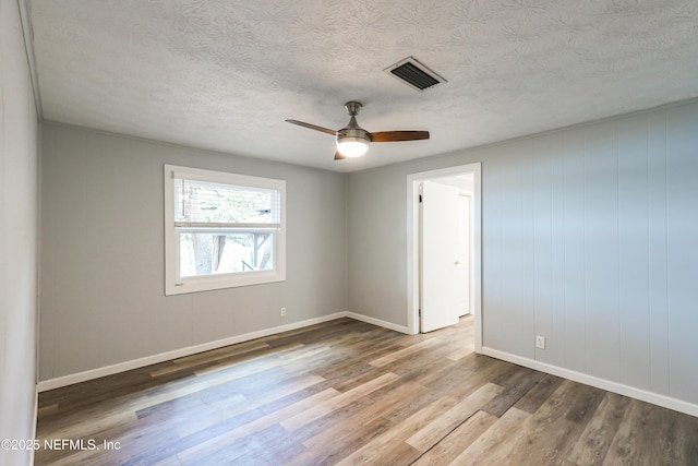 5299 County Road 352nd Rd, Keystone Heights, FL 32656 - spare room with wood finished floors, ceiling fan, and a textured ceiling