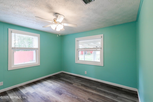 5299 County Road 352nd Rd, Keystone Heights, FL 32656 - unfurnished room featuring dark wood finished floors, a textured ceiling, and a ceiling fan