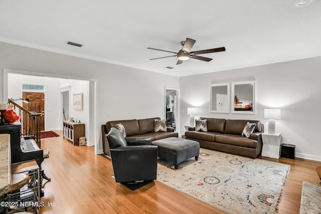 1805 Commodore Point Dr, Fleming Island, FL 32003 - living room with ceiling fan, light wood-style flooring, and crown molding