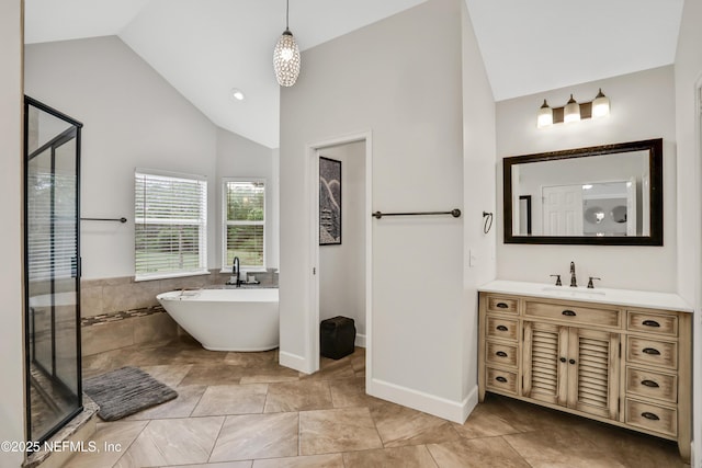 1805 Commodore Point Dr, Fleming Island, FL 32003 - full bath with a soaking tub, a shower stall, vanity, and high vaulted ceiling