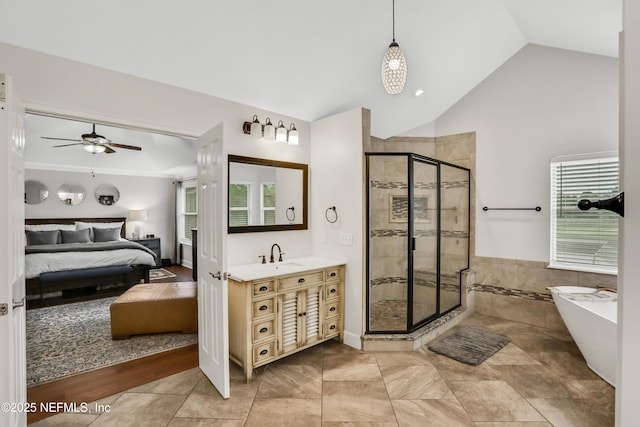 1805 Commodore Point Dr, Fleming Island, FL 32003 - ensuite bathroom featuring a stall shower, vanity, lofted ceiling, a freestanding tub, and ceiling fan