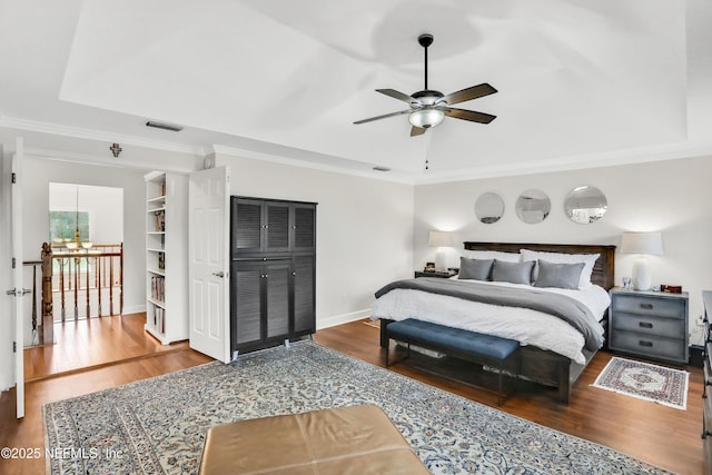 1805 Commodore Point Dr, Fleming Island, FL 32003 - bedroom featuring wood finished floors, crown molding, and a ceiling fan