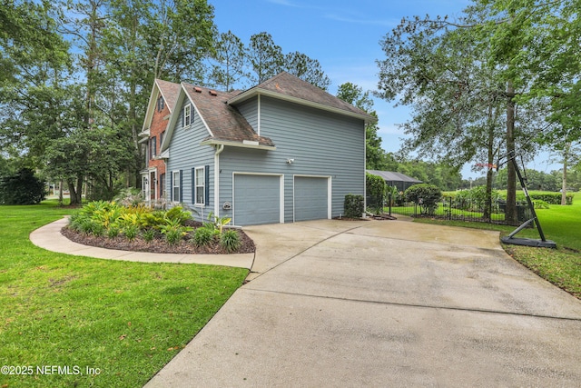 1805 Commodore Point Dr, Fleming Island, FL 32003 - view of side of property featuring concrete driveway, an attached garage, and a shingled roof