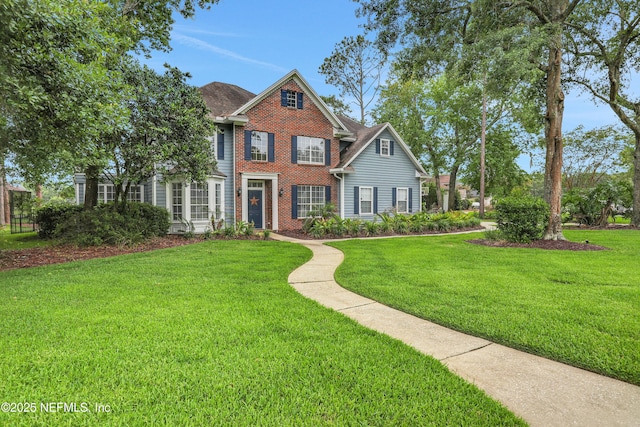 1805 Commodore Point Dr, Fleming Island, FL 32003 - view of front of property with brick siding and a front lawn