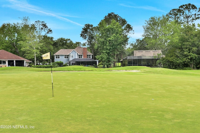 1805 Commodore Point Dr, Fleming Island, FL 32003 - surrounding community featuring a yard, golf course view, an area to practice putting, and view of wooded area