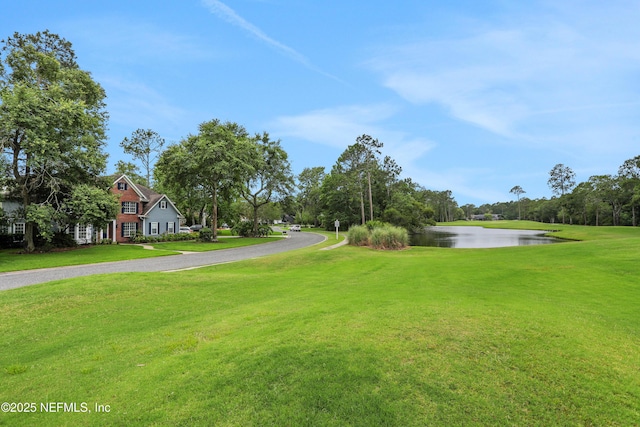 1805 Commodore Point Dr, Fleming Island, FL 32003 - view of green lawn with a water view and driveway
