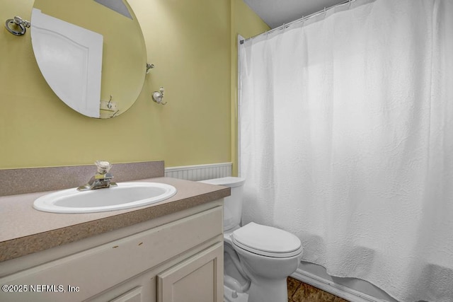 1069 Ardmore St, Saint Augustine, FL 32092 - full bath with vanity, curtained shower, and a wainscoted wall
