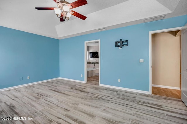 1069 Ardmore St, Saint Augustine, FL 32092 - unfurnished bedroom with wood finished floors, a ceiling fan, and ensuite bathroom