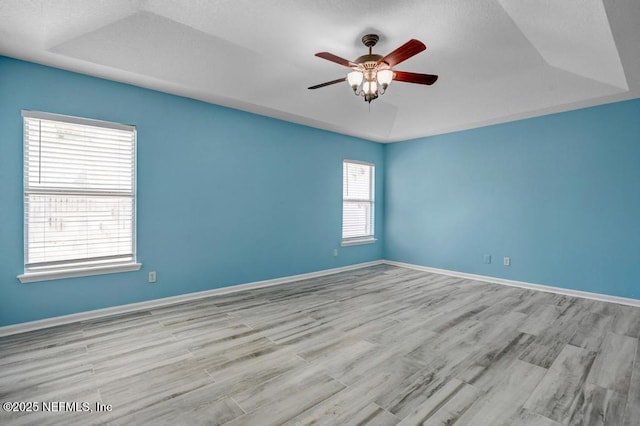 1069 Ardmore St, Saint Augustine, FL 32092 - spare room with a tray ceiling, ceiling fan, and wood finished floors