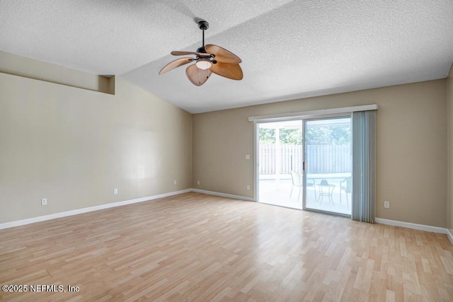 1069 Ardmore St, Saint Augustine, FL 32092 - unfurnished room with ceiling fan, light wood finished floors, a textured ceiling, and vaulted ceiling