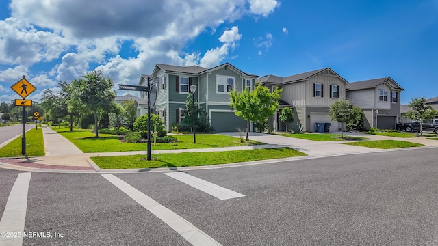 21 Vicksburg Dr, Saint Johns, FL 32259 - view of property featuring concrete driveway, a garage, a residential view, and a front yard