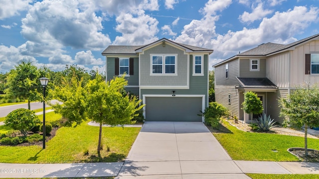 21 Vicksburg Dr, Saint Johns, FL 32259 - view of front of home featuring a garage, concrete driveway, and a front lawn