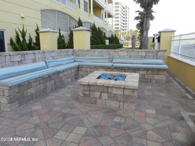 1031 1st St S Unit 504, Jacksonville Beach, FL 32250 - view of patio with a fire pit