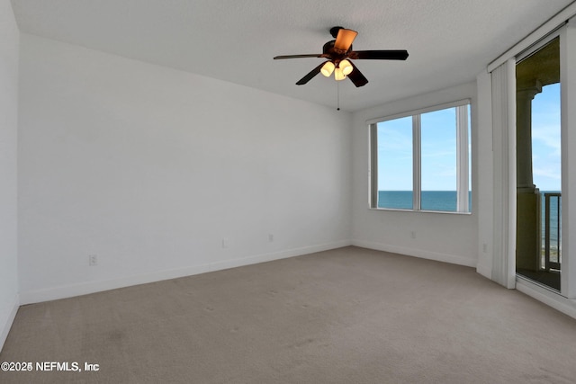 1031 1st St S Unit 504, Jacksonville Beach, FL 32250 - unfurnished room with light carpet and ceiling fan
