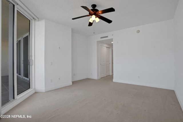 1031 1st St S Unit 504, Jacksonville Beach, FL 32250 - spare room featuring ceiling fan and light carpet