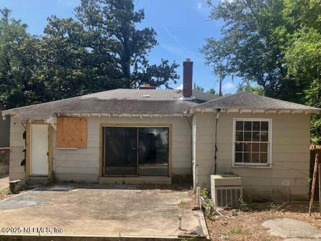 625 W 46th St, Jacksonville, FL 32208 - back of house featuring a chimney and a patio area