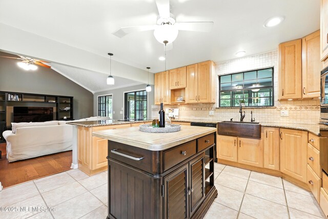 726 Arran Ct, Orange Park, FL 32073 - kitchen with a ceiling fan, light brown cabinetry, vaulted ceiling, decorative backsplash, and light tile patterned flooring