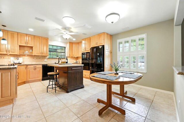 726 Arran Ct, Orange Park, FL 32073 - kitchen featuring black appliances, light brown cabinets, tasteful backsplash, a kitchen island, and recessed lighting