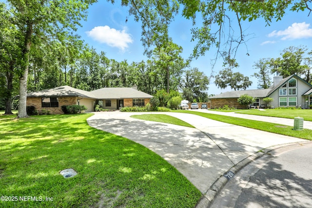 726 Arran Ct, Orange Park, FL 32073 - ranch-style home featuring concrete driveway, a garage, and a front lawn
