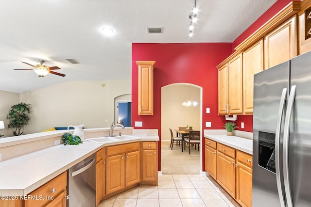 1517 Remington Way, Saint Augustine, FL 32084 - kitchen featuring appliances with stainless steel finishes, arched walkways, light countertops, a ceiling fan, and light colored carpet