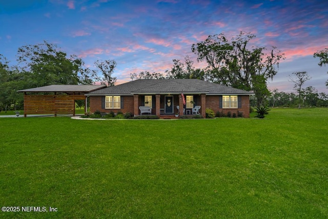 26122 Sheared Stokes Rd, Hilliard, FL 32046 - single story home with a lawn and covered porch