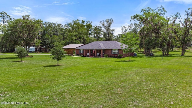 26122 Sheared Stokes Rd, Hilliard, FL 32046 - view of front of property featuring a front lawn and a porch