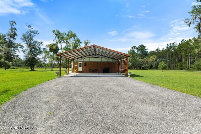 26122 Sheared Stokes Rd, Hilliard, FL 32046 - garage with a carport and driveway