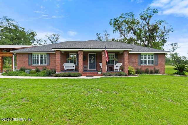 26122 Sheared Stokes Rd, Hilliard, FL 32046 - ranch-style home with covered porch, a front yard, and brick siding