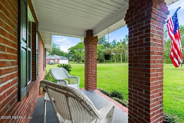 26122 Sheared Stokes Rd, Hilliard, FL 32046 - covered porch with a lawn