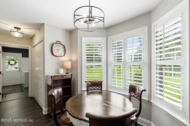 26122 Sheared Stokes Rd, Hilliard, FL 32046 - dining room featuring a chandelier, healthy amount of natural light, and wood finished floors