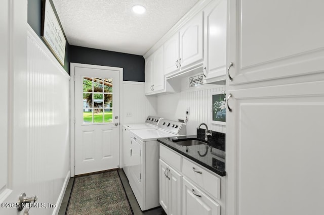 26122 Sheared Stokes Rd, Hilliard, FL 32046 - laundry area with washer and clothes dryer, cabinet space, and a textured ceiling