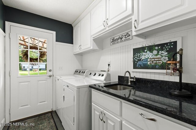 26122 Sheared Stokes Rd, Hilliard, FL 32046 - laundry room with independent washer and dryer, cabinet space, and dark tile patterned floors