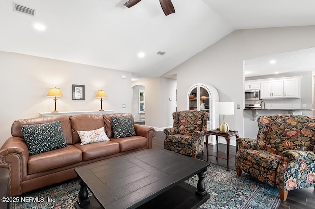 26122 Sheared Stokes Rd, Hilliard, FL 32046 - living area featuring arched walkways, wood finished floors, a ceiling fan, recessed lighting, and high vaulted ceiling