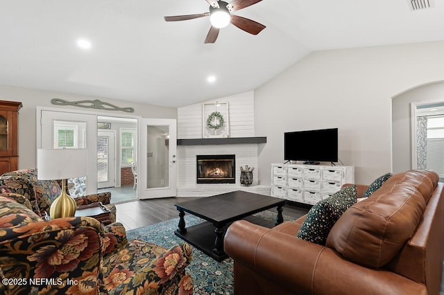 26122 Sheared Stokes Rd, Hilliard, FL 32046 - living area featuring vaulted ceiling, healthy amount of natural light, ceiling fan, wood finished floors, and a brick fireplace