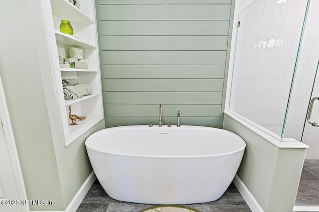 26122 Sheared Stokes Rd, Hilliard, FL 32046 - full bathroom with baseboards and a freestanding bath