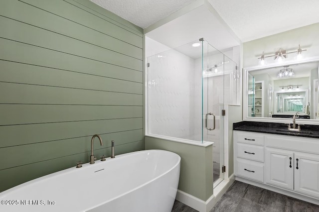 26122 Sheared Stokes Rd, Hilliard, FL 32046 - bathroom with wood finished floors, vanity, a freestanding tub, and a stall shower