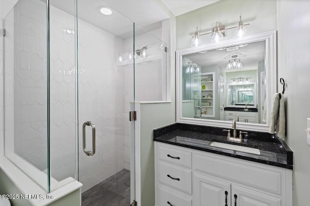 26122 Sheared Stokes Rd, Hilliard, FL 32046 - full bathroom with a stall shower, vanity, and wood finished floors
