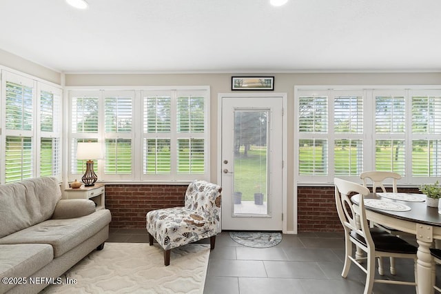 26122 Sheared Stokes Rd, Hilliard, FL 32046 - sunroom / solarium with brick wall, plenty of natural light, and tile patterned flooring