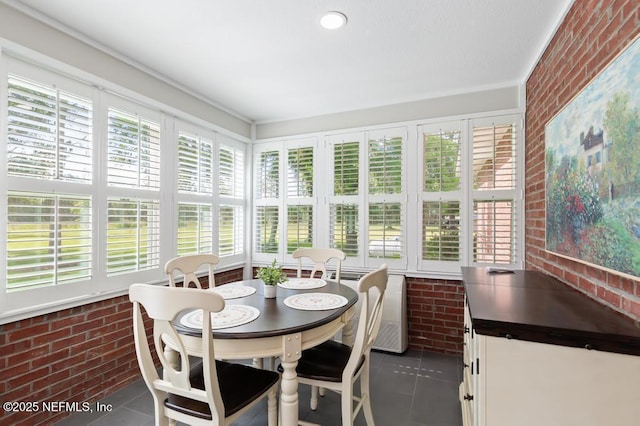 26122 Sheared Stokes Rd, Hilliard, FL 32046 - sunroom featuring brick wall and tile patterned floors