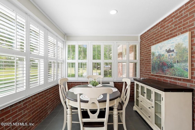 26122 Sheared Stokes Rd, Hilliard, FL 32046 - sunroom / solarium featuring brick wall and tile patterned flooring